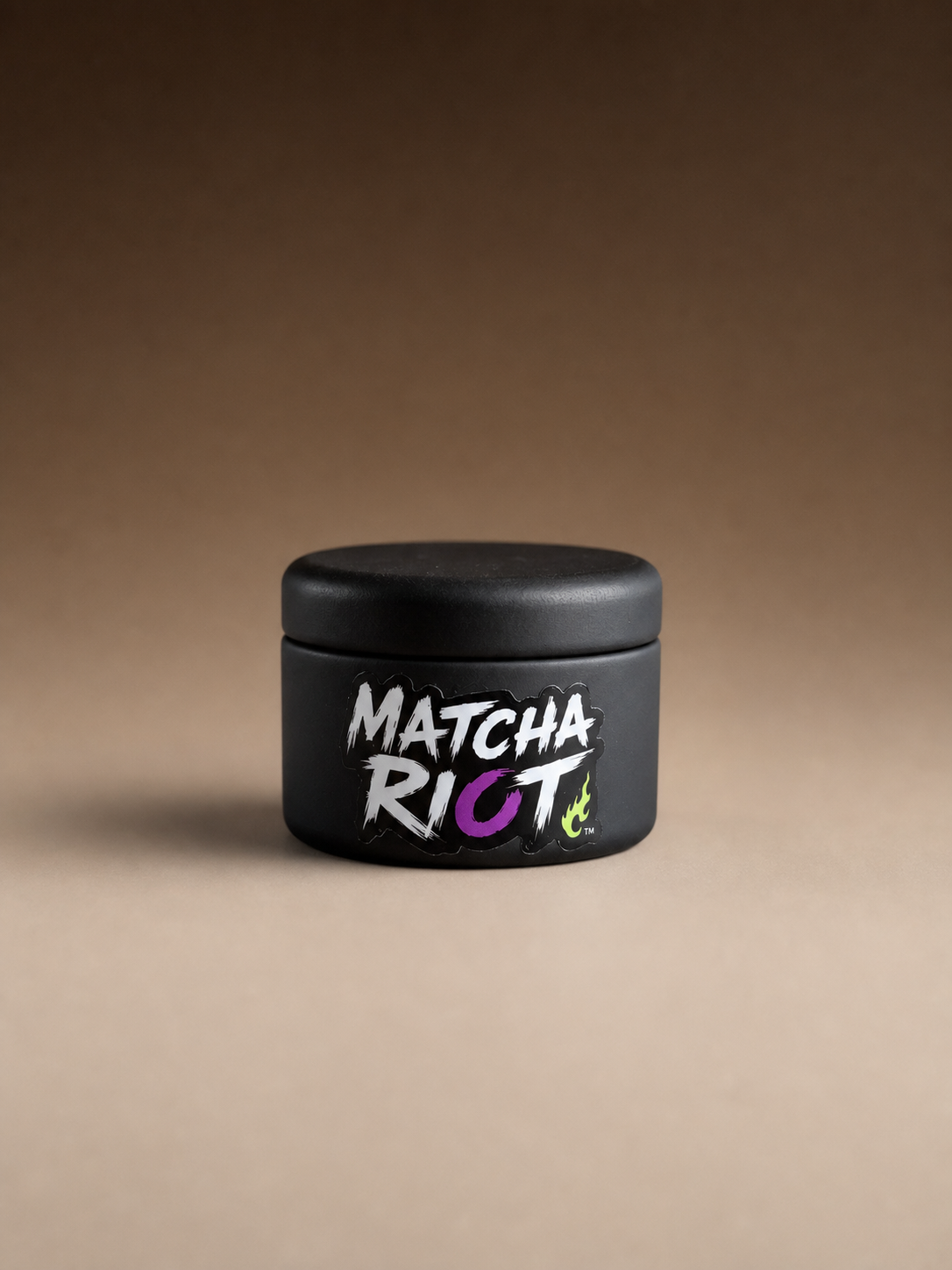 Black Matcha Riot DROP 001 ceremonial matcha tin on a neutral background