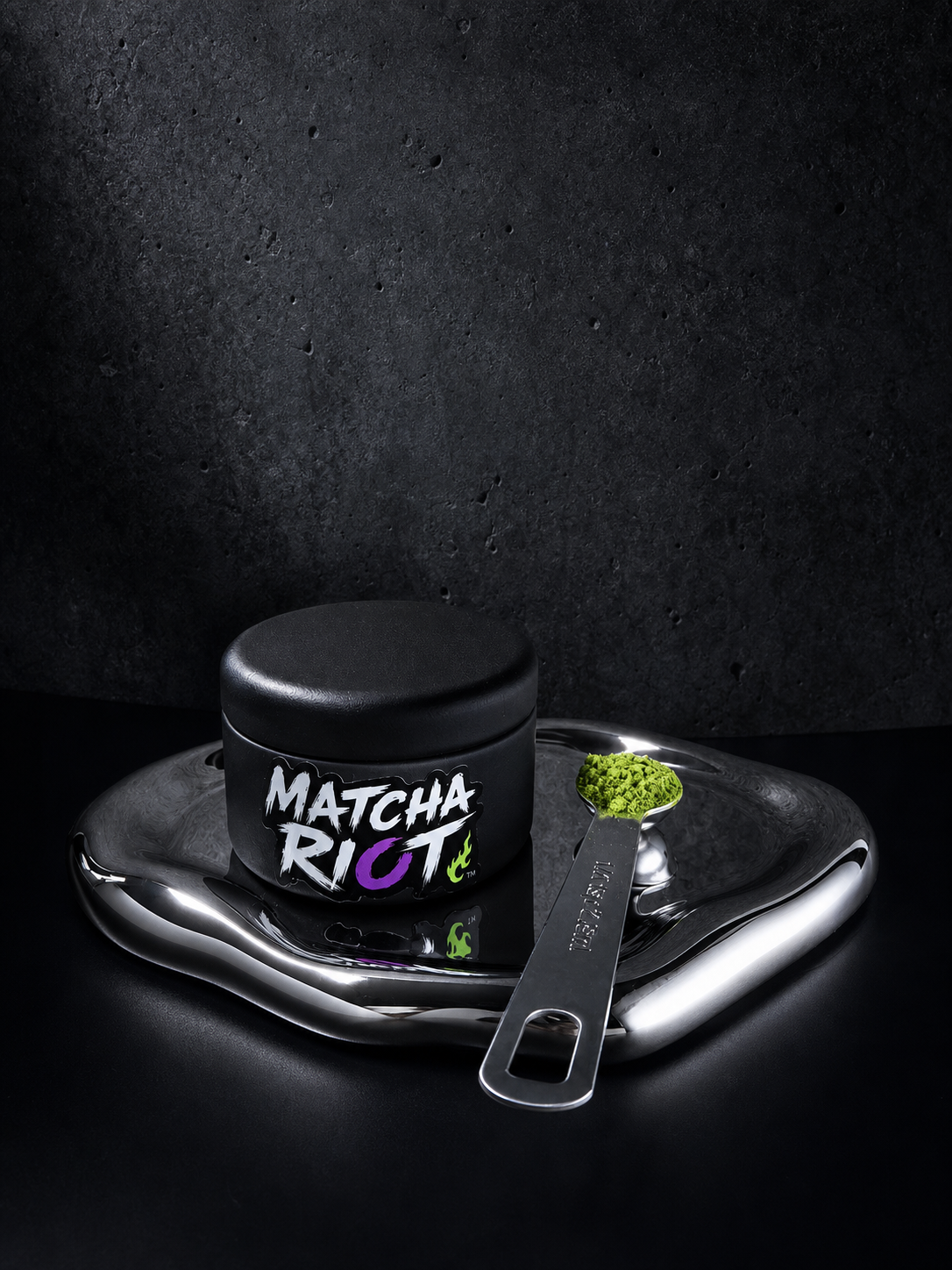 Matcha Riot DROP 001 tin with matcha scoop